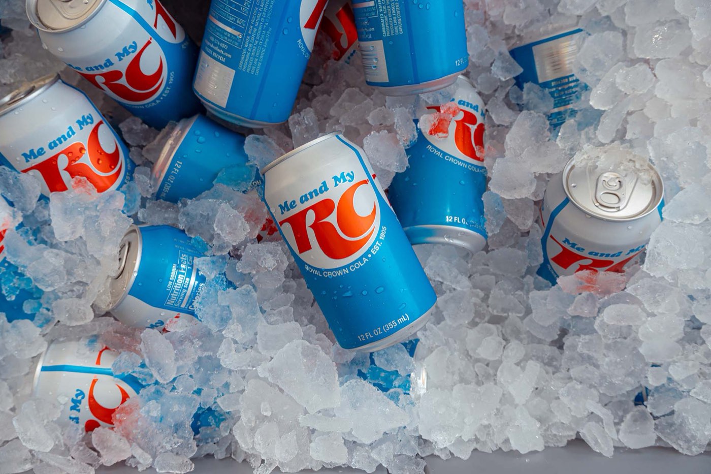 Cans of RC Cola buried in ice in a cooler